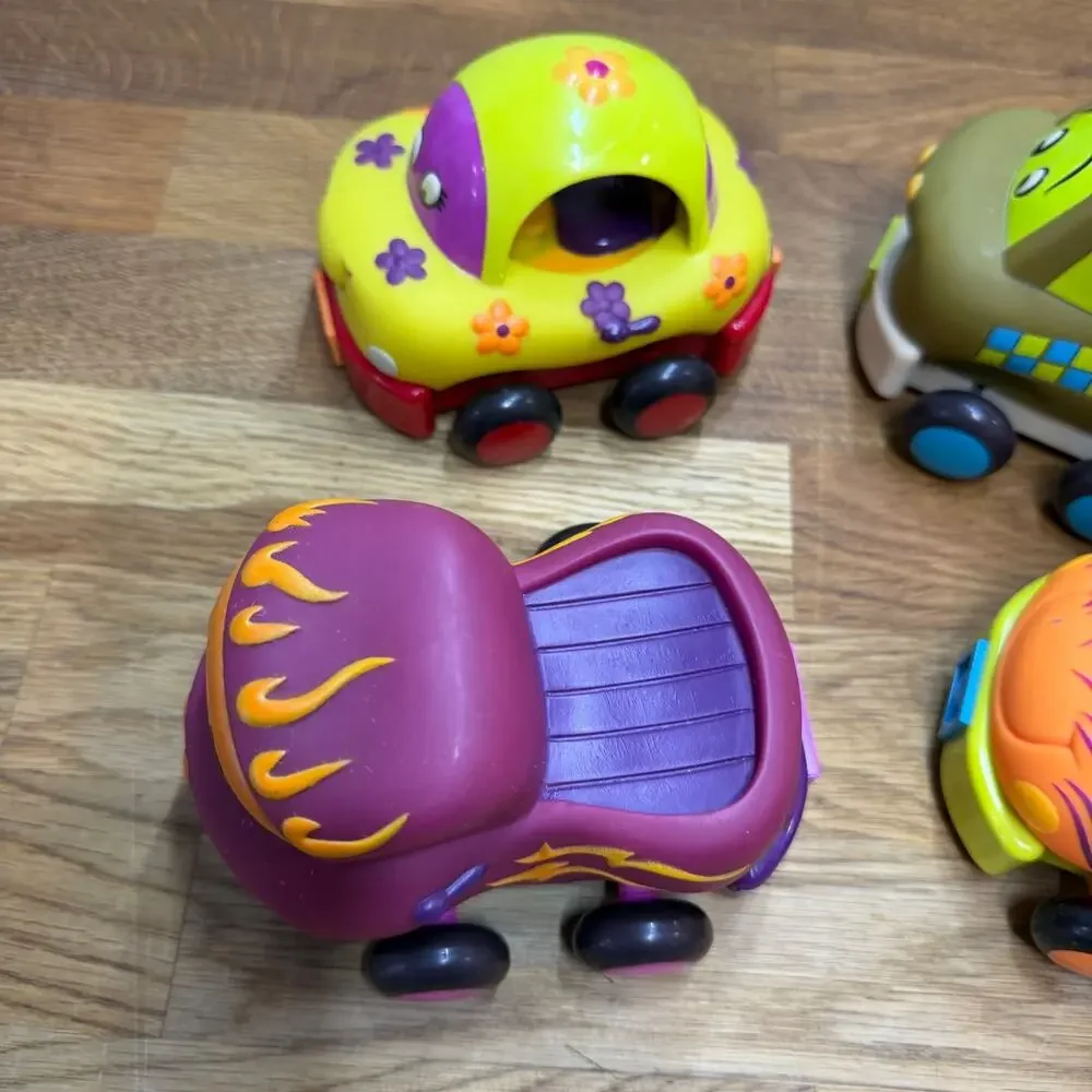 B. Toys Pull Back Trucks Taxi Cab Convertible Lot of 4 Flower Car Play Imaginati
